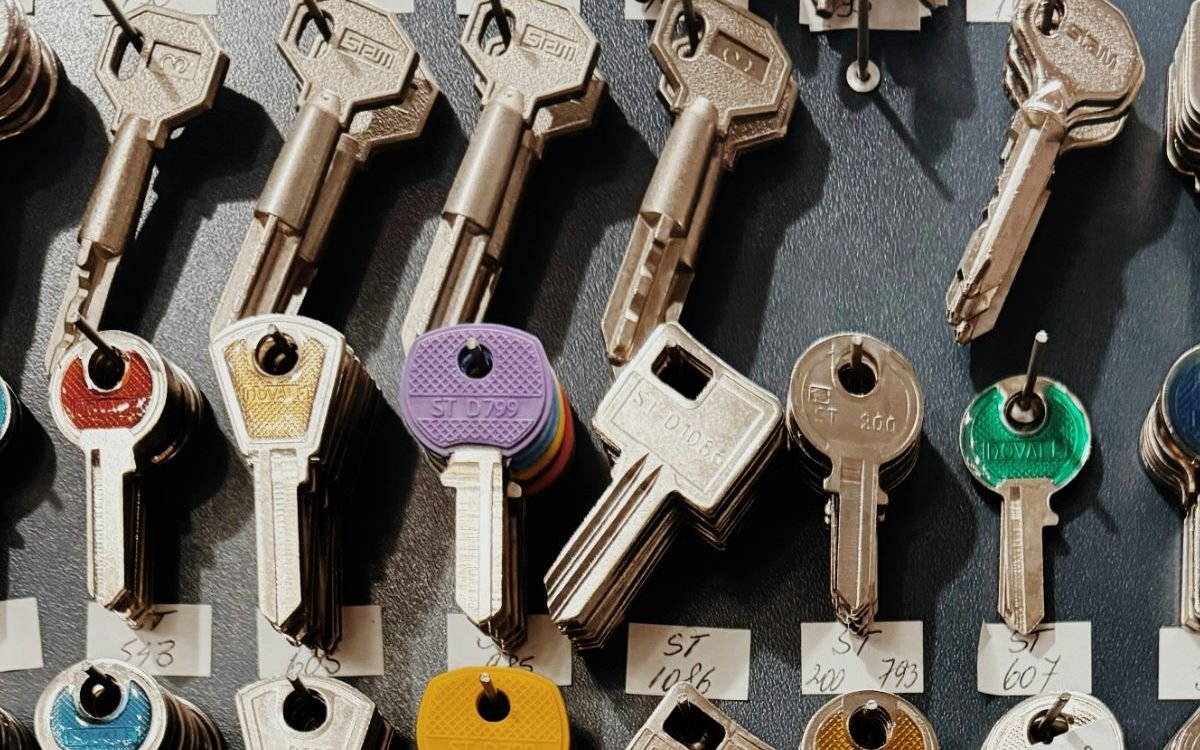 Key blanks sorted into labelled rows on a workshop board
